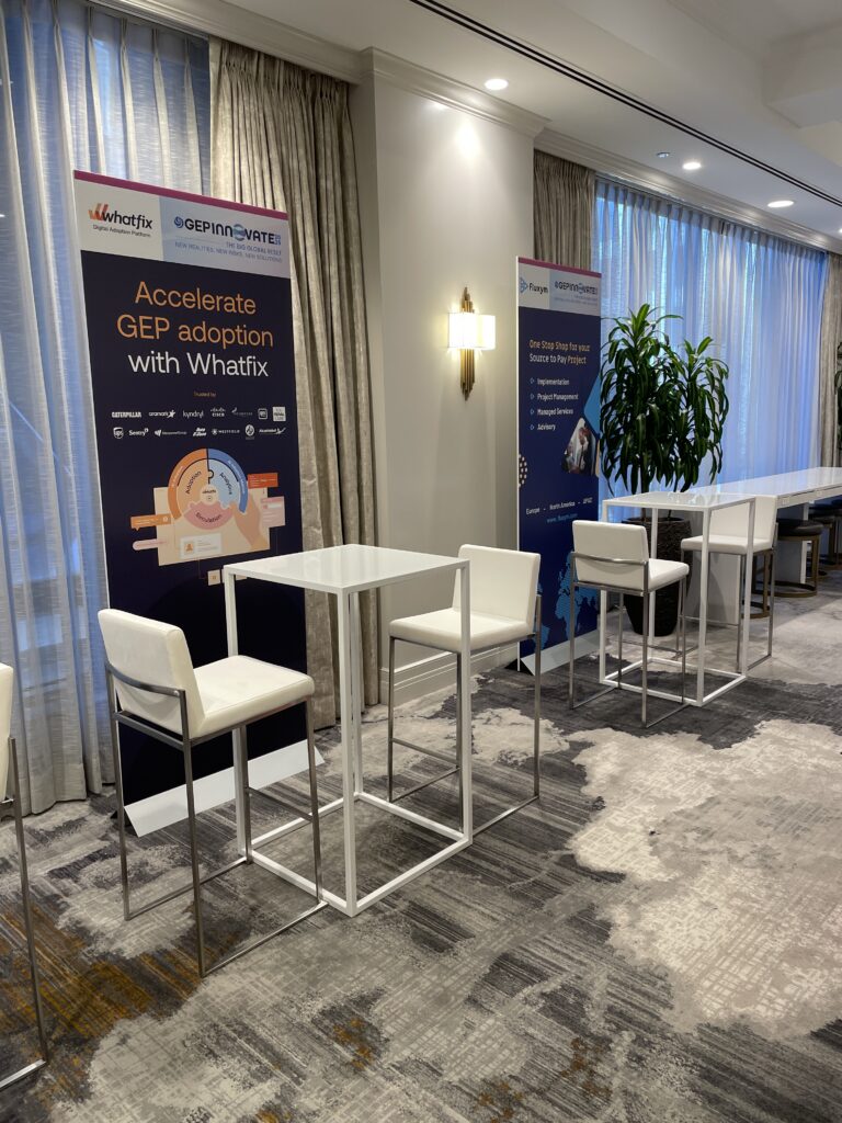 AHR Expo booth furniture: white bar-height tables and stools set up in an exhibitor booth